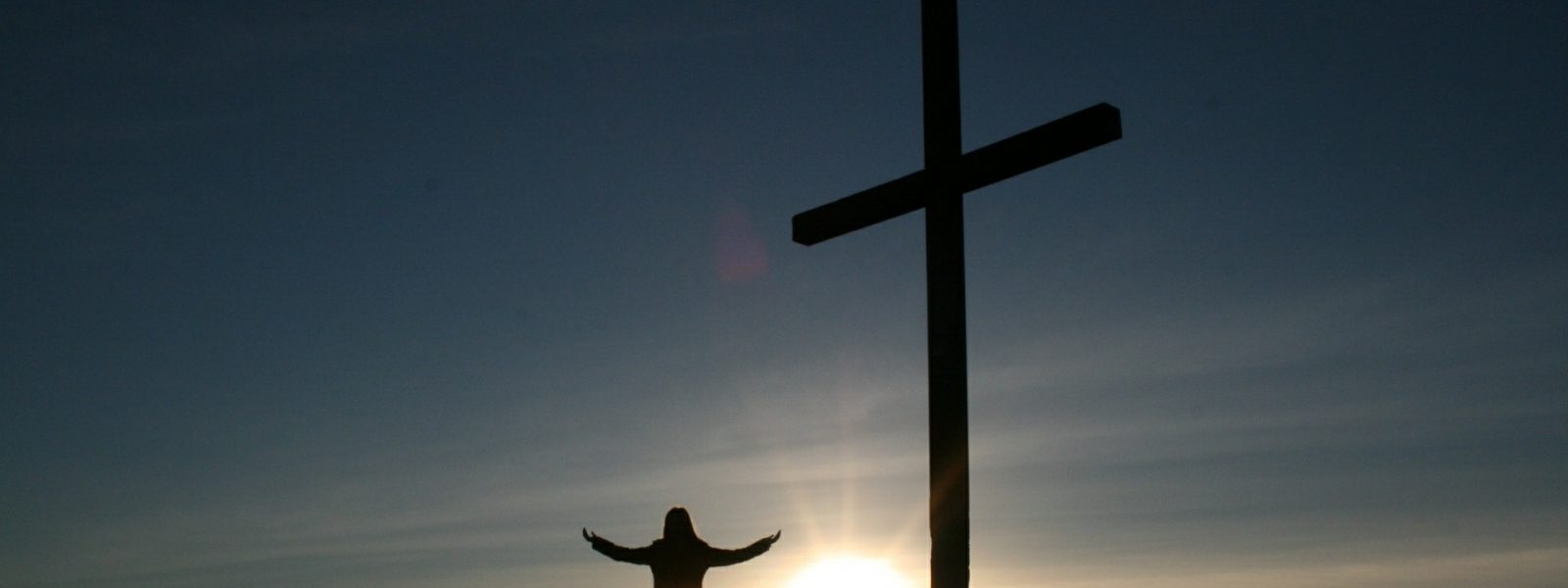 Catholic cross and person