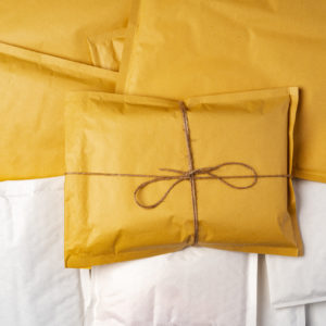 AdobeStock_494446041-Close up of stack of padded mailing envelopes