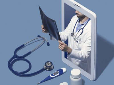 AdobeStock_271731457_Professional doctor in a smartphone giving a consultation online and checking a radiography, telemedicine and healthcare concept, blank copy space