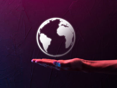 AdobeStock_498225722_Businessman man hand holding Earth icon , digital globe.