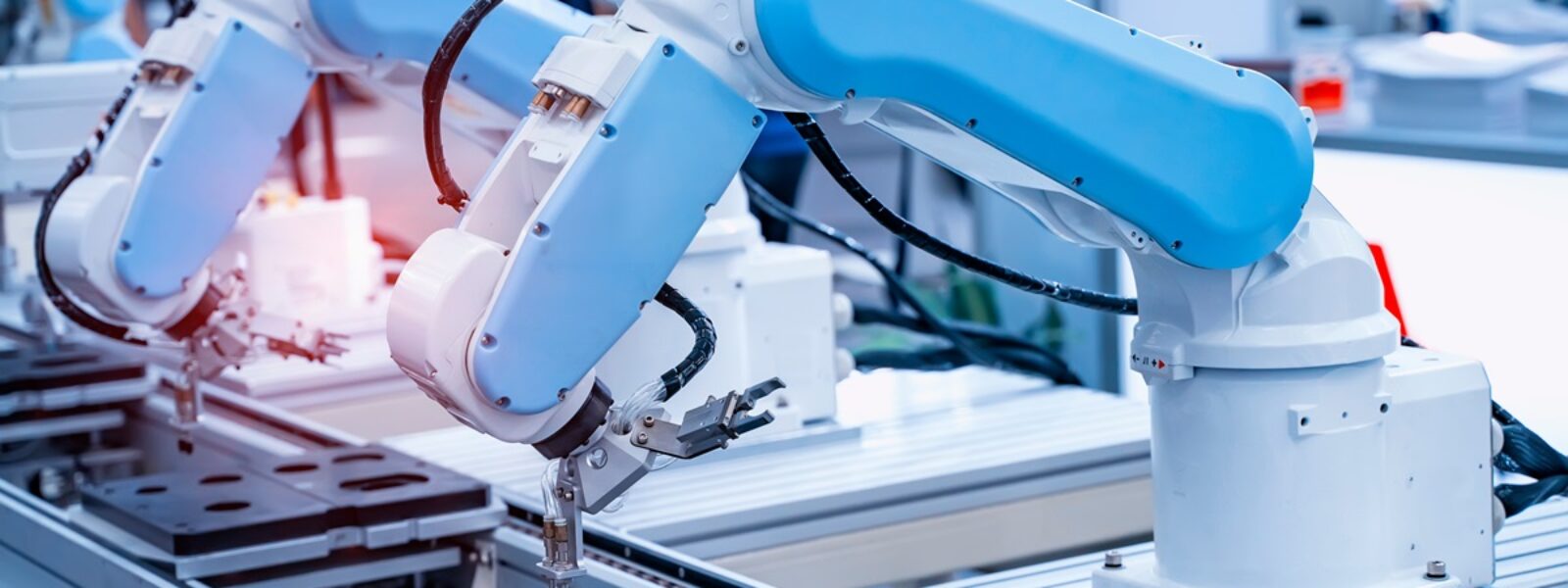 AdobeStock_287866501_robotic arm catch for electronic assembly line. The robot for sm